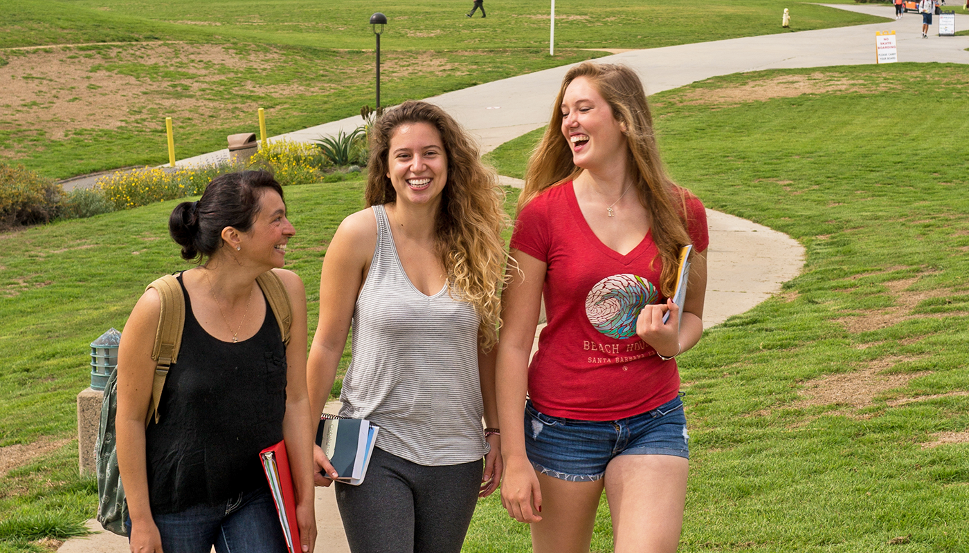 Three SBCC international students walking on campus.
